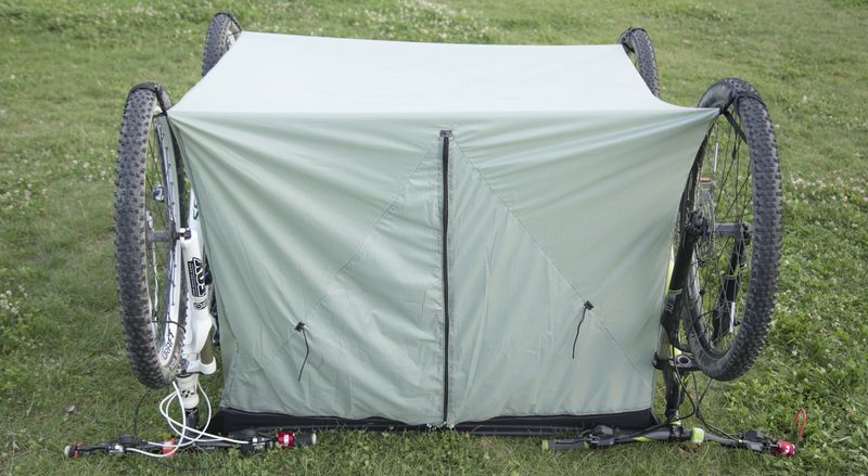 Inner tent hanging between two upside-down bikes